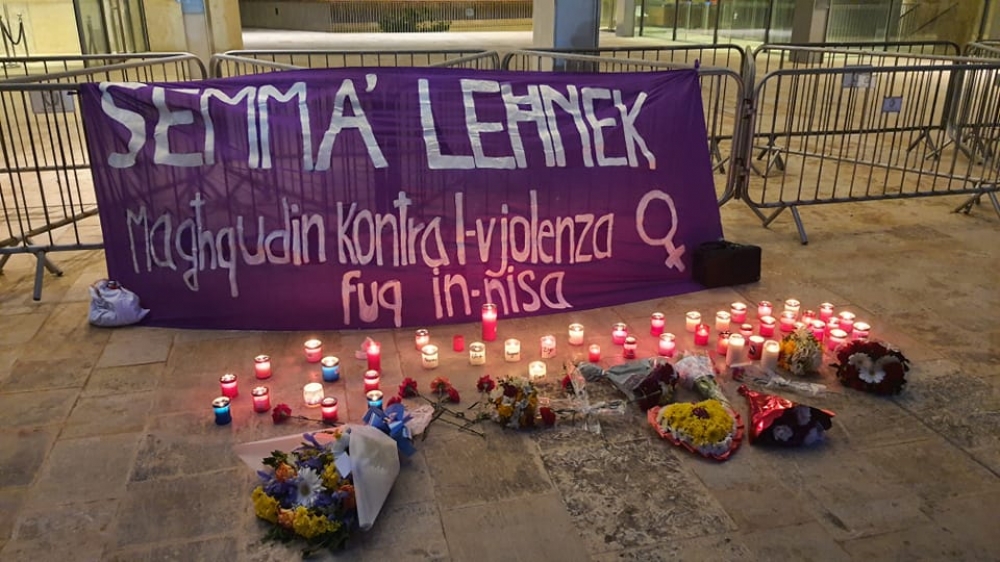 Attendees left candles and flowers outside the parliament building