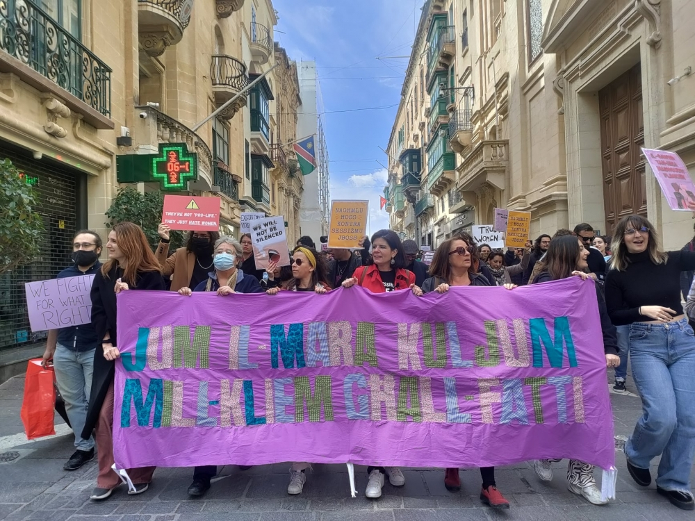 Each year, dozens of people, many carrying placards, march down Republic Street in Valletta on Women's day. 