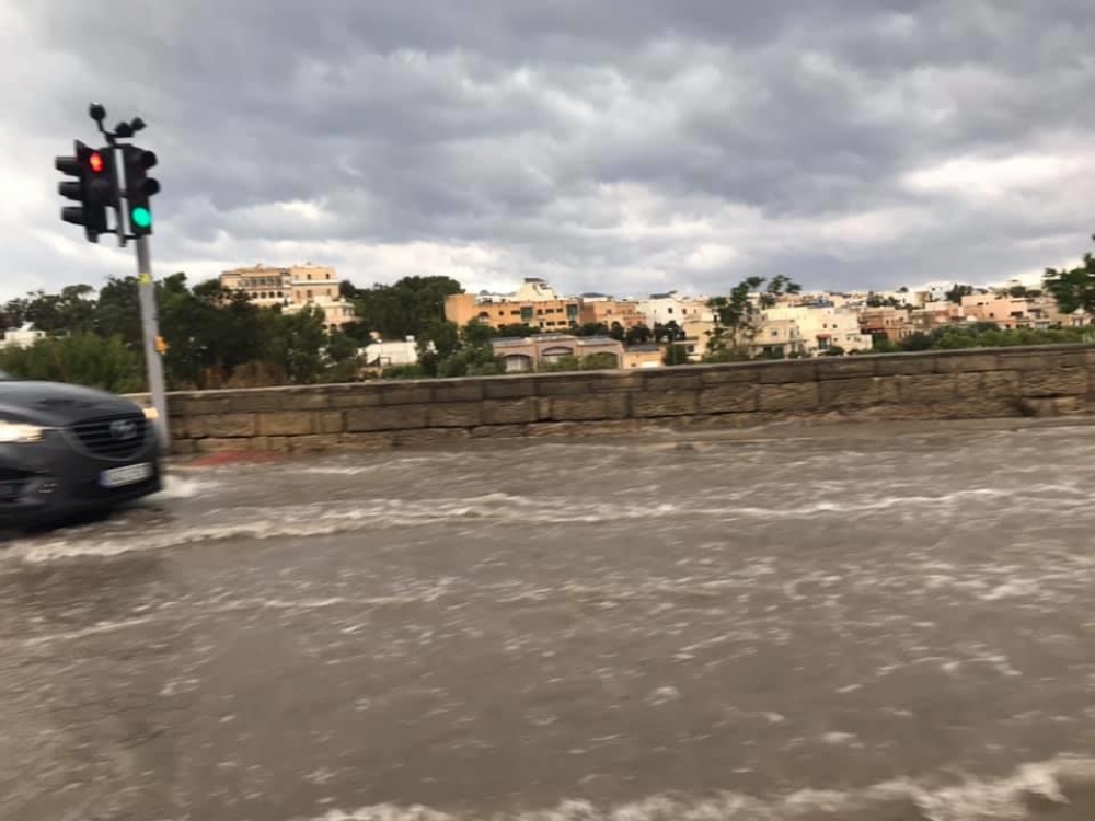 A temporary opening has been created to allow water on the St Andrews-Paceville road drain into the valley