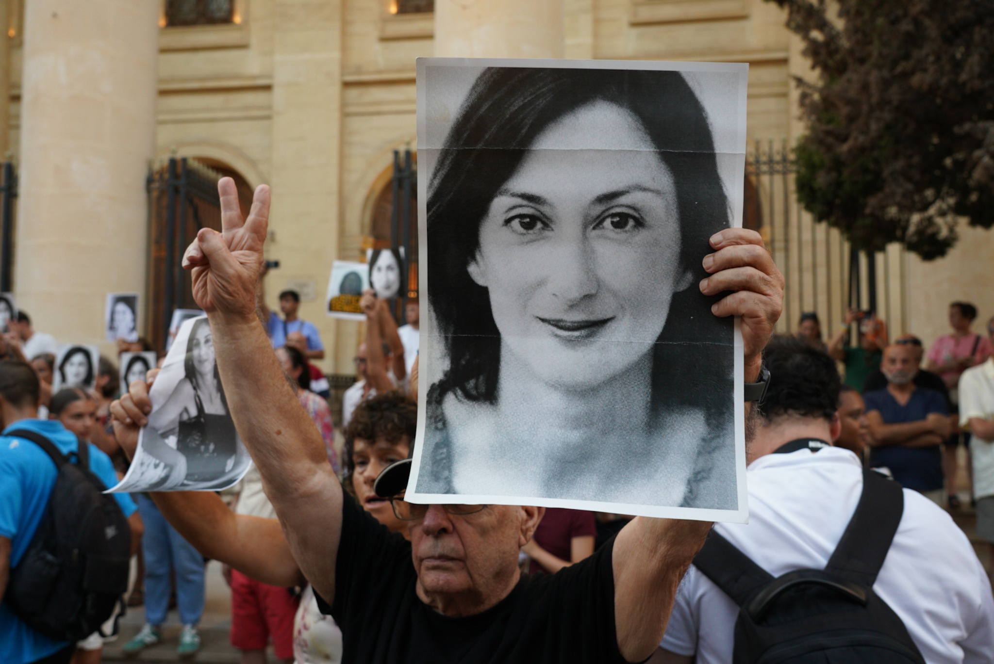 Dozens gathered with printed photographs of the journalist near the Courts whilst official ceremonies took place nearby (Photo: James Bianchi/MaltaToday)