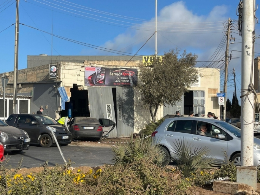 One of the cars crashed into a garage on the roundabout corner