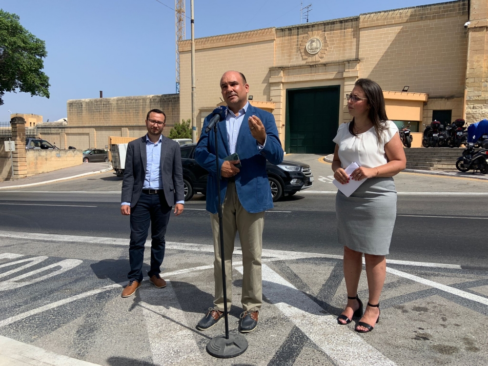 PN spokesperson Peter Agius (center) accompanied by PN candidates Darren Carabott (left) and Graziella Galea (right)