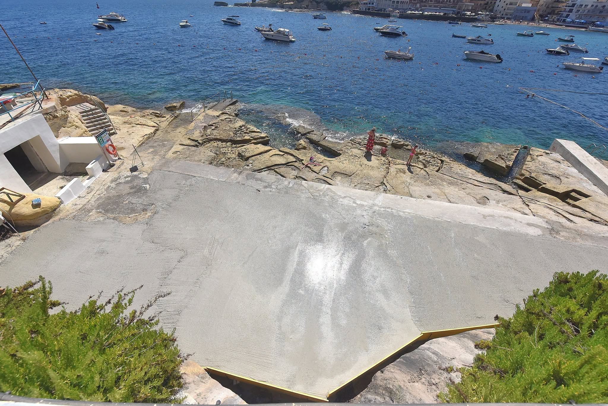 In the photos, cement can be seen to have been poured on the coastal rocks of Marsalforn (Photo: Facebook)