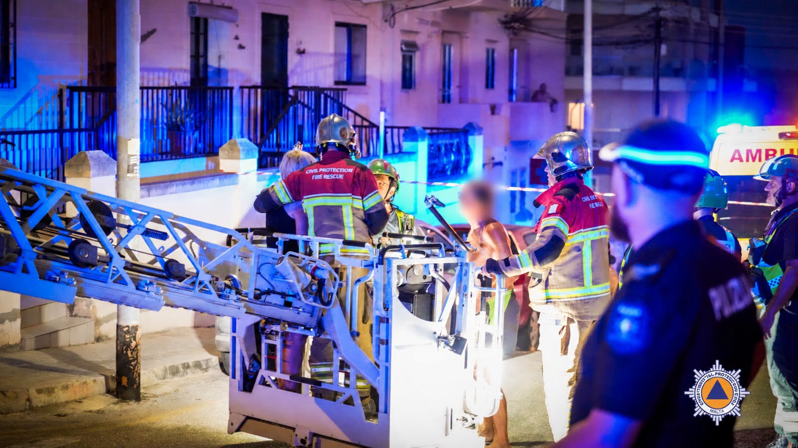 Firefighters rescue five people and dog trapped in burning building
