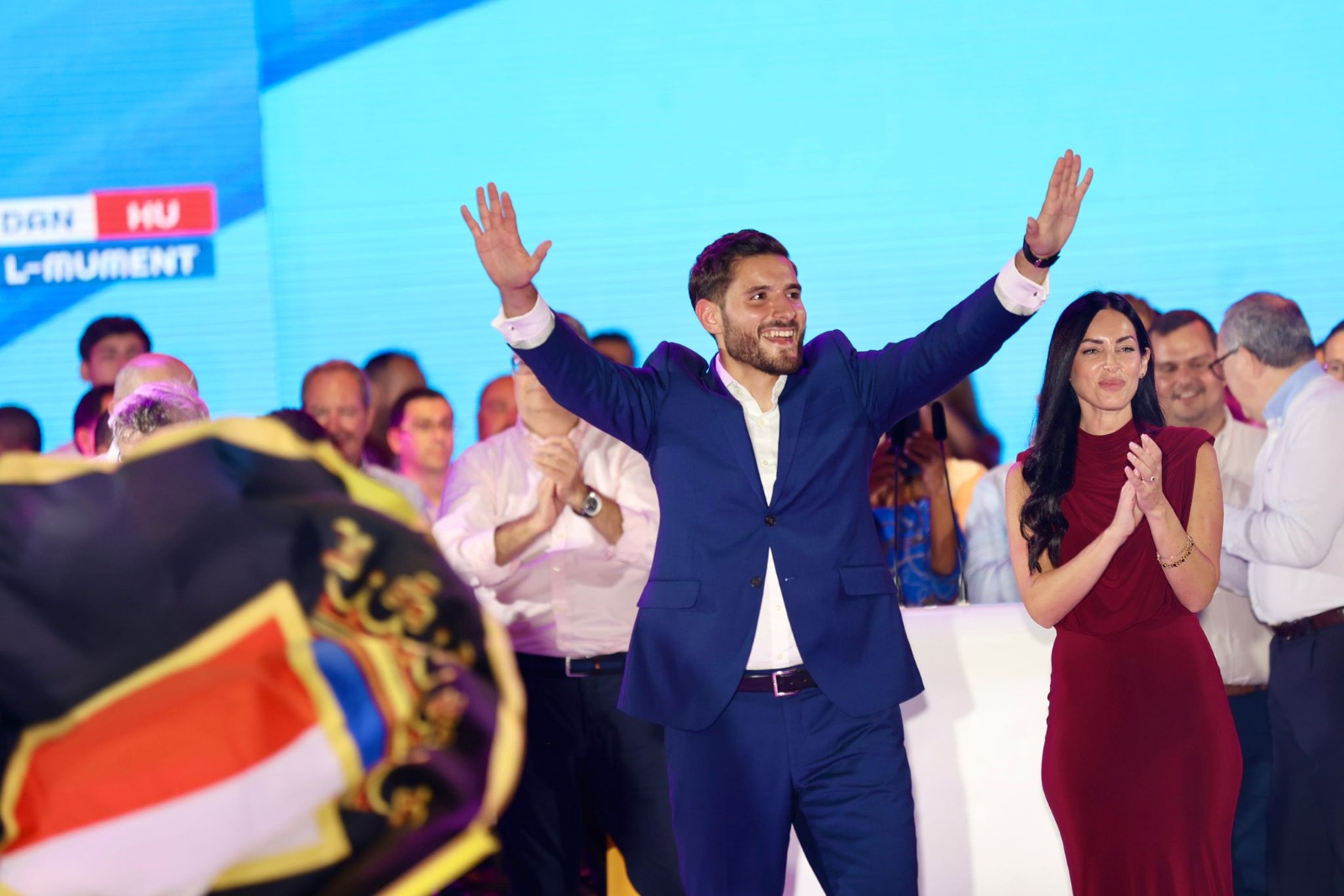 Alex Borg accompanied by his partner Sarah Bajada waving to supporters after the meeting (Photo: PN)