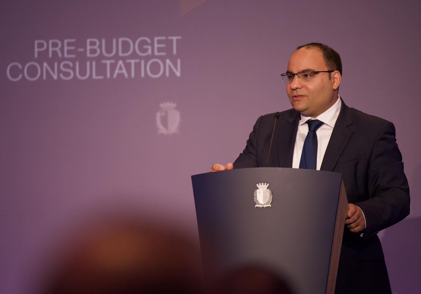 Finance Minister Clyde Caruana addressing a public consultation on the pre-budget document