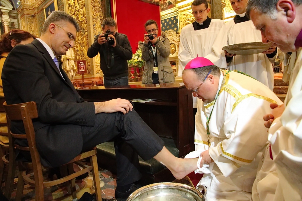 Archbishop washes feet of 12 men providing service to community