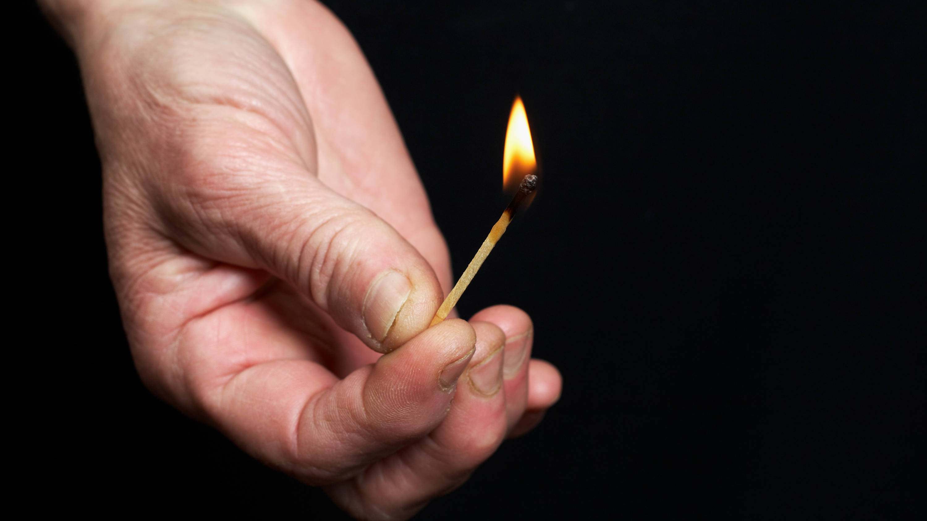 Man caught on CCTV footage pouring a liquid on the car and setting it alight (File photo)