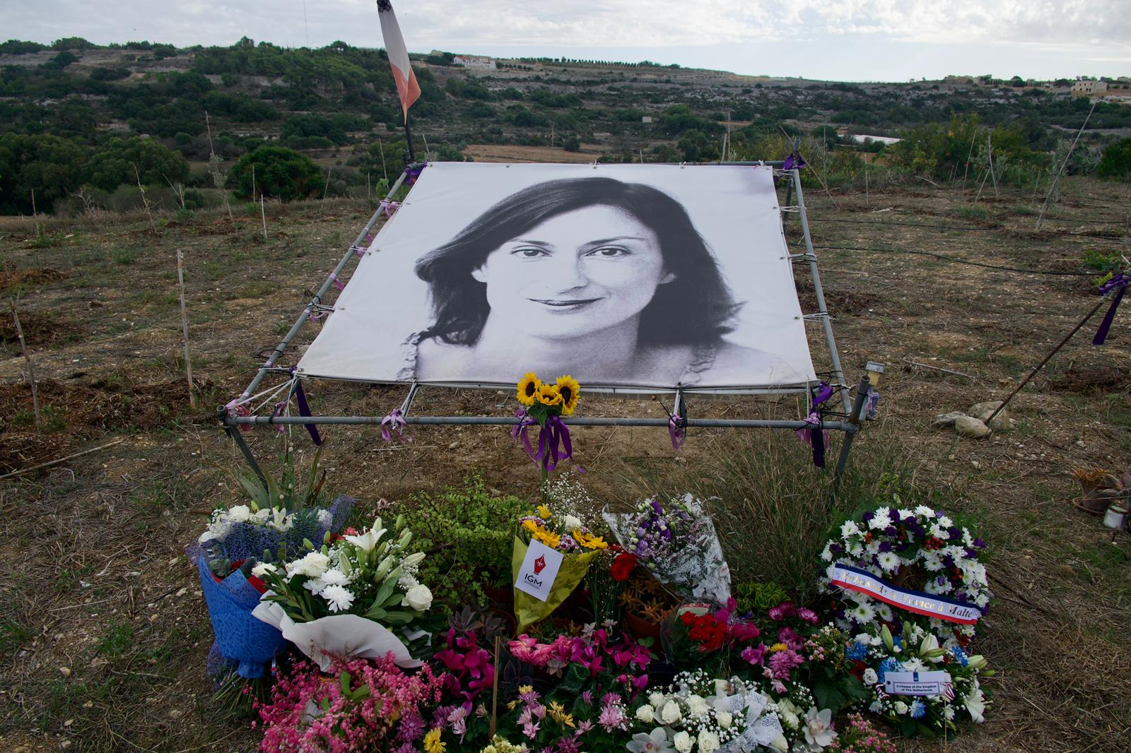 A big poster with Daphne's face marks the spot where her burning car stopped after a powerful explosion ripped it apart (Photo: Miguela Xuereb/Newsbook)