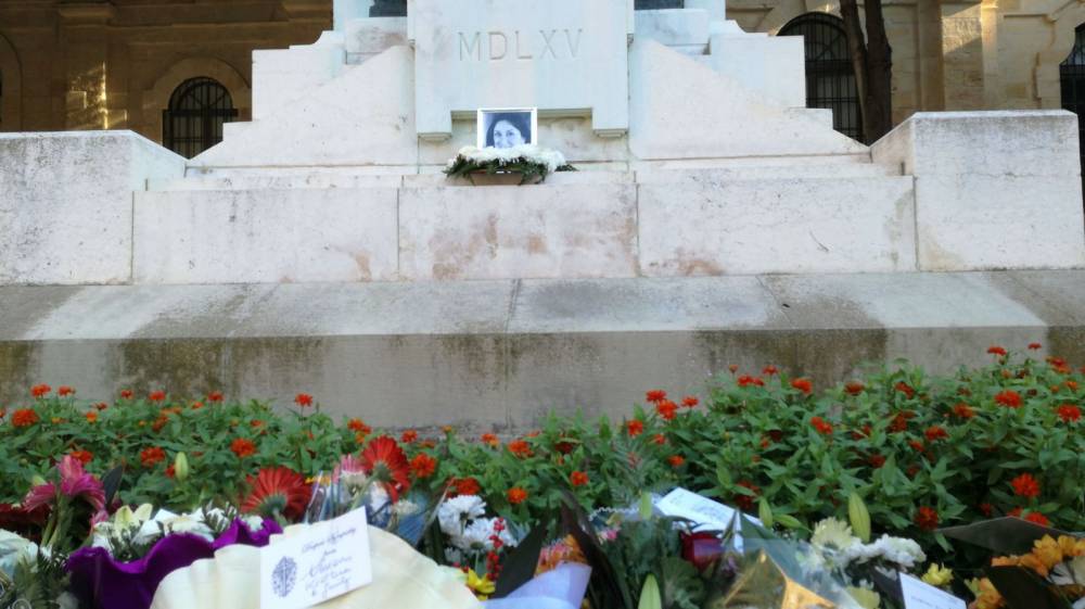 A photo of Daphne Caruana Galizia was placed at the foot of the Great Siege monument