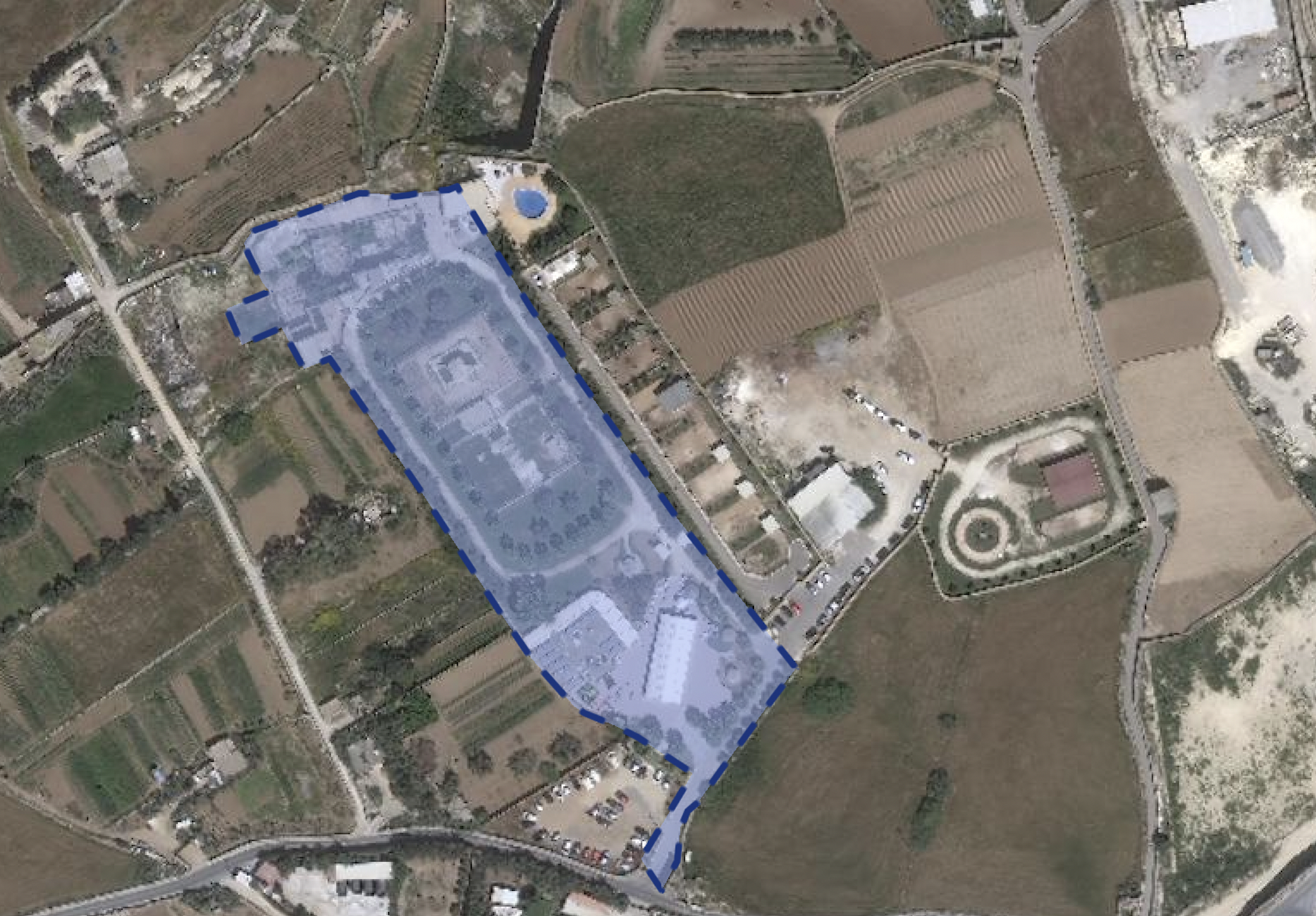 Aerial photo of site showing the new development beyond the boundaries of the original permit enclosed in blue dotted line
