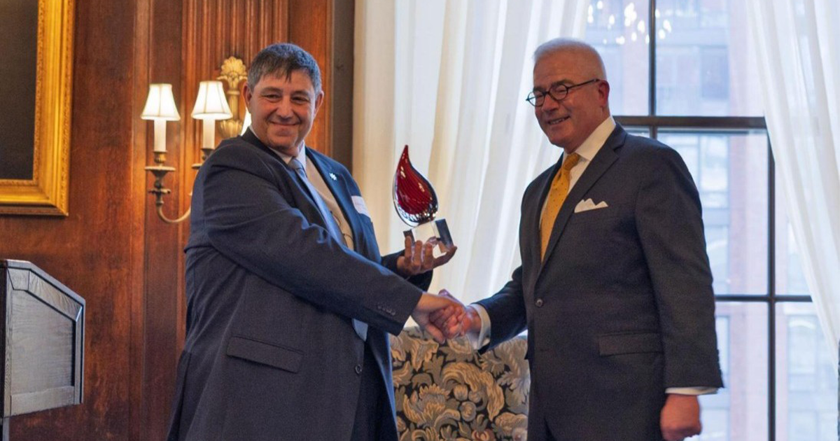 Jesmond Gatt, chairman of the MFSA (left), receives the Insurance Federation of New York’s 2025 Free Enterprise Award from Howard Mills, president of IFNY