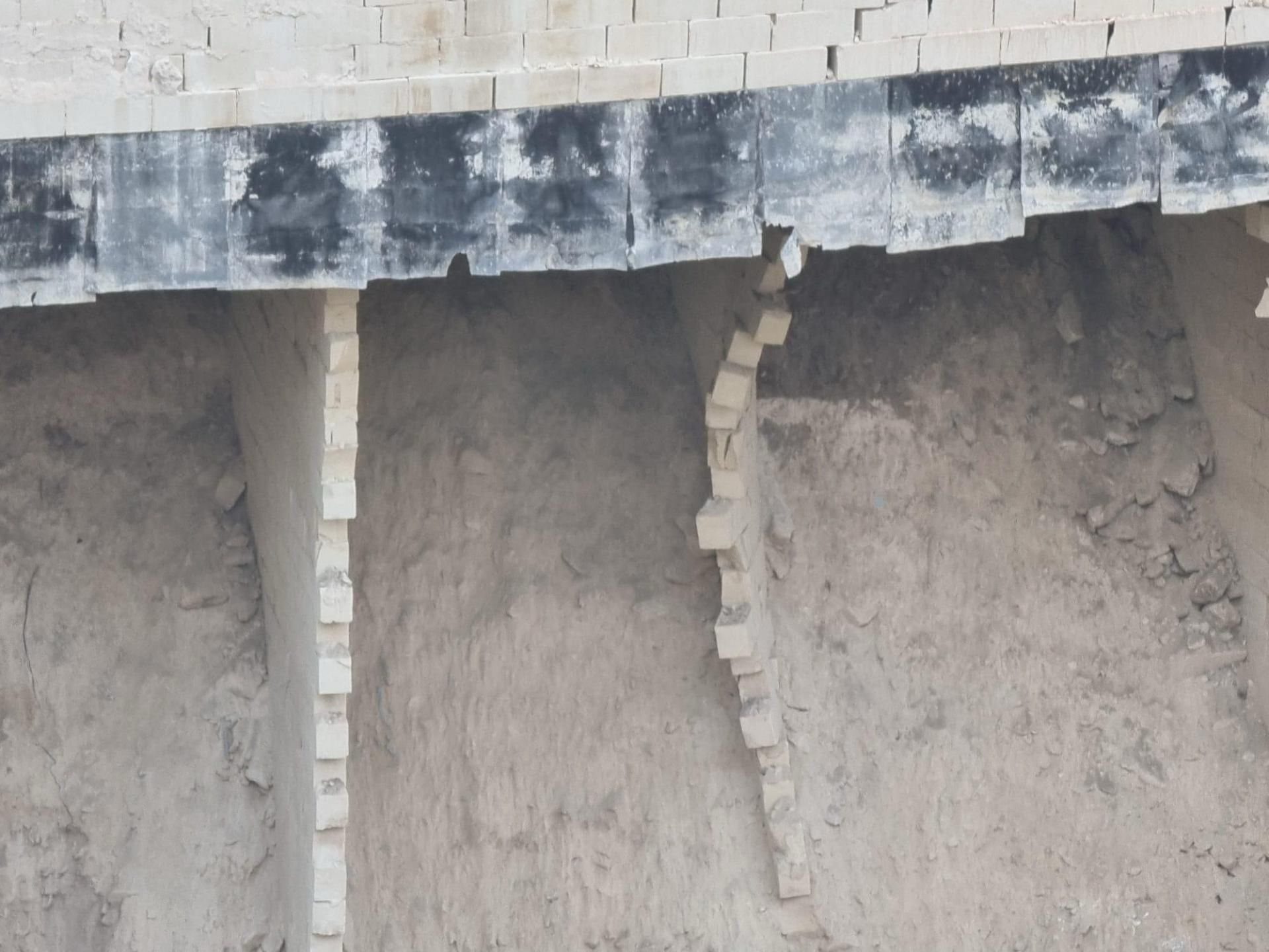 A close up of one of the narrow supporting walls buckling under the weight of the construction above it (Photo supplied by a resident)