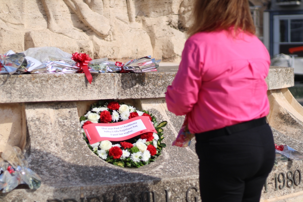 Isabelle Bonnici lays a wreath in front of the monument