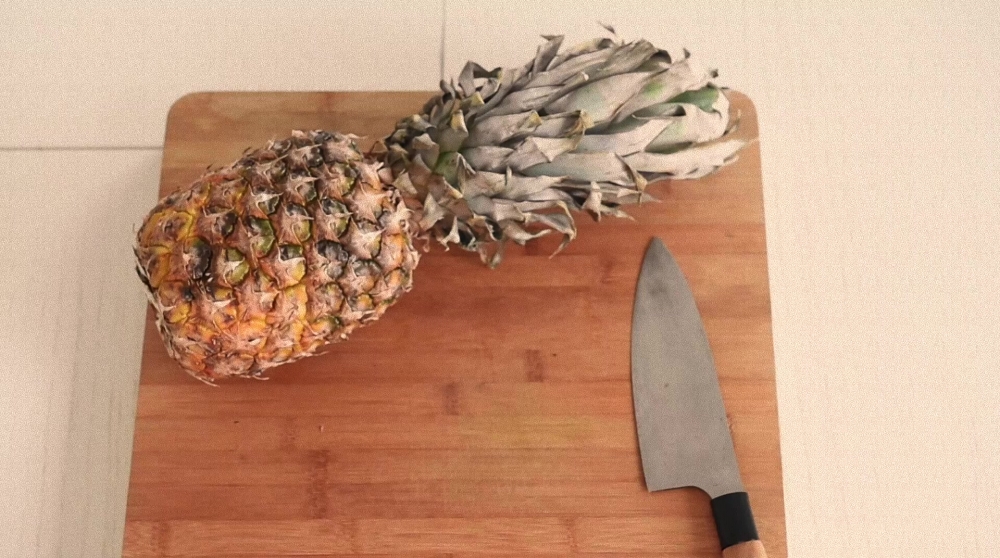 Cutting a pineapple