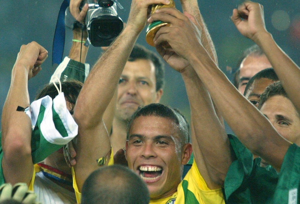 Ronaldo lifting the World Cup in 2002. He was also the tournament’s top scorer with eight goals. Credit: picture-alliance / Sven Simon