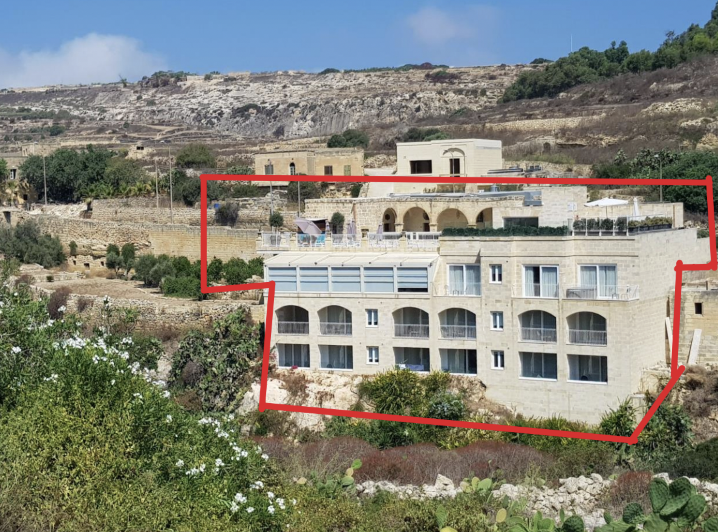 The current site earmarked in red
