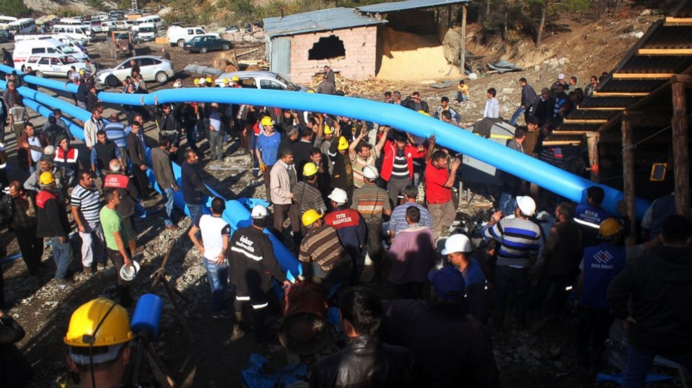 Emergency personnel are working to pump water out of the flooded mine in Ermenek