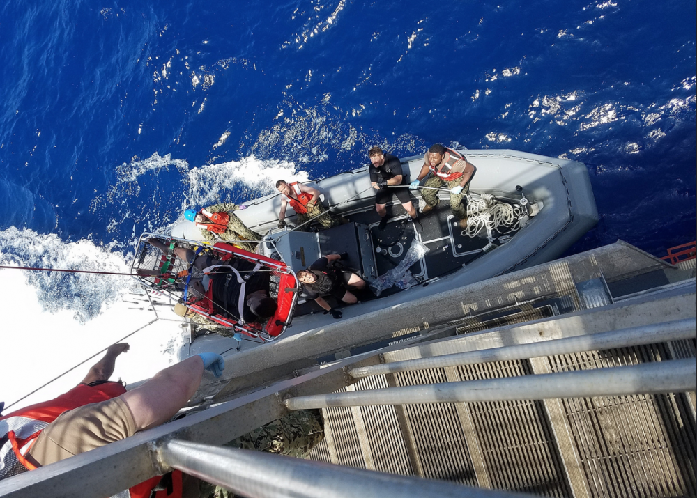 US navy ship with 41 rescued migrants outside Sicilian port of Augusta