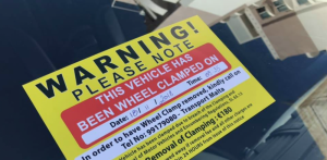 Cars with foreign number plates get clamped over illegal parking