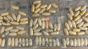 Man charged after he was caught at airport with 100 cocaine capsules in stomach