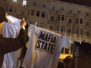Occupy Justice activists peg ‘mafia state’ laundry outside shuttered Pilatus bank