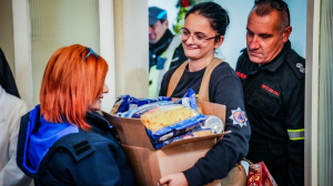 Law enforcement officers collect and distribute food to those in need