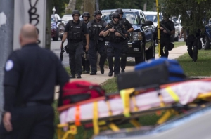 Wounded doctor returns fire on hospital gunman