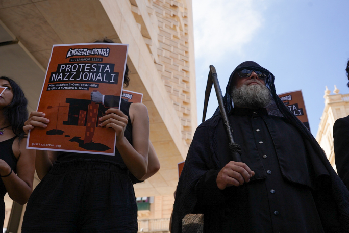 Grim reapers walk through the streets of Valletta in protest to government’s planning bills