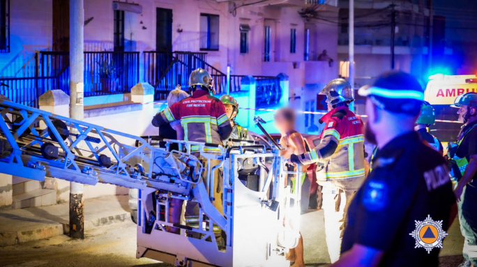 Firefighters rescue five people and dog trapped in burning building