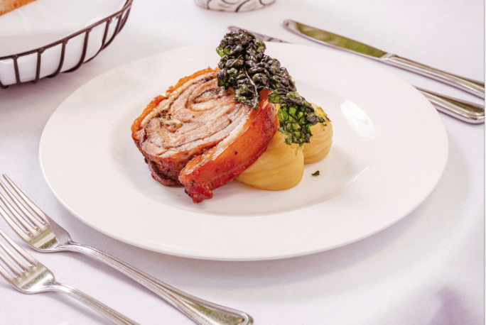 Porchetta with pumpkin mash and salsa verde