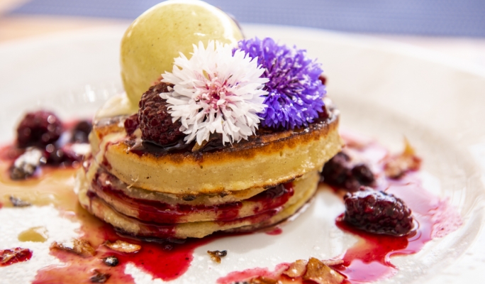 Hot cakes with mixed berries and ice-cream