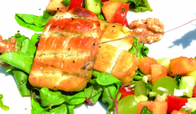 Barbequed halloumi cheese with melon and grape salad