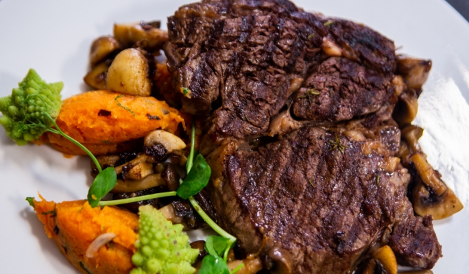Rib-eye steak with sweet potatoes and mushrooms